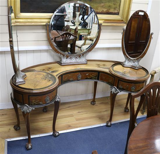 A 1930s chinoiserie dressing table with side revolving mirrors W.160cm